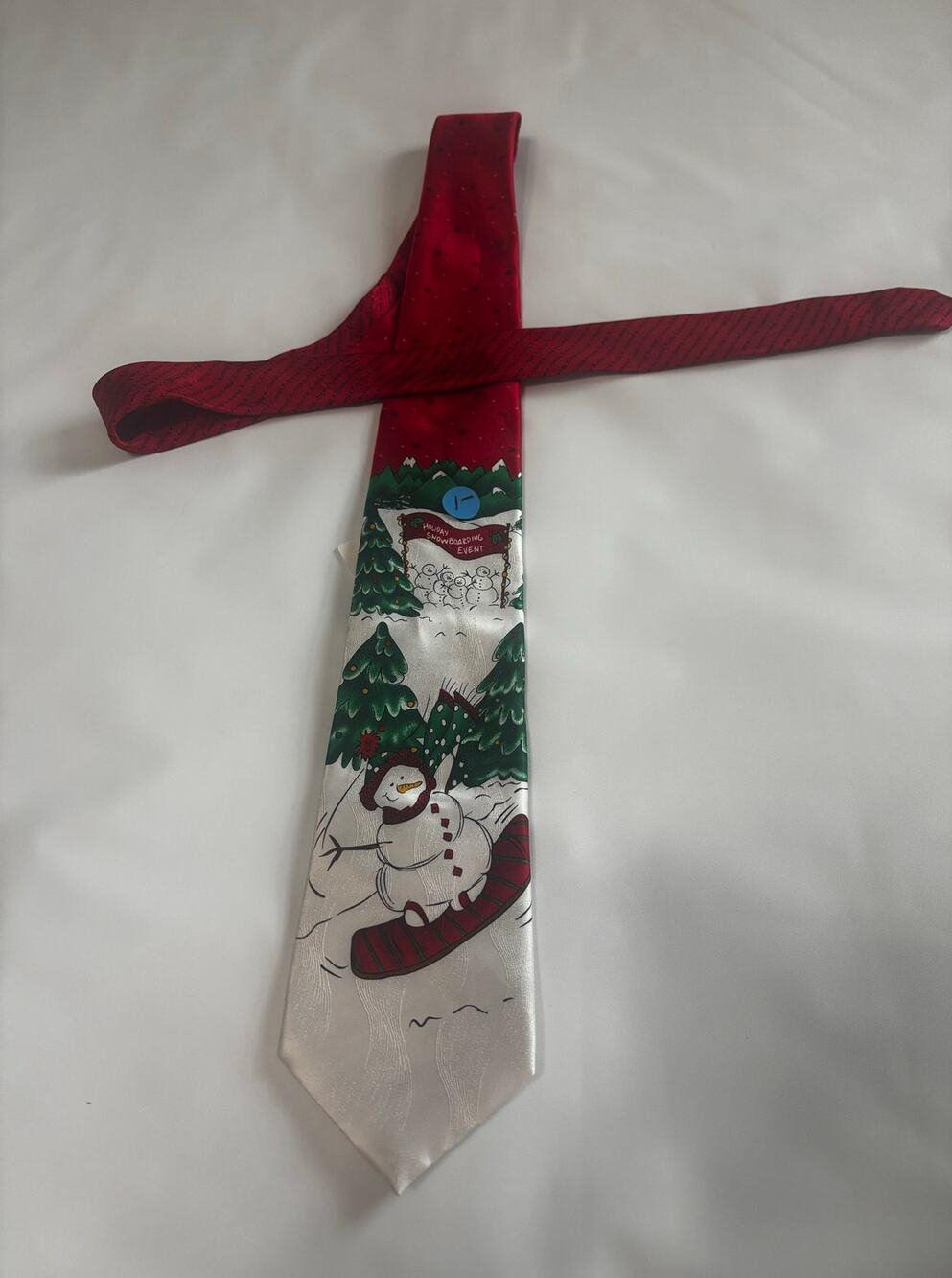 Christmas holiday themed tie, 100% silk, green, red, black on snow background